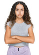 © Krakenimages.com - Teenager hispanic girl wearing casual clothes skeptic and nervous, disapproving expression on face with crossed arms. negative person.