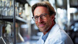 © mendor - Mature male scientist with hair pulled back and stylish glasses in a laboratory setting