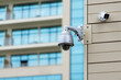 Security Camera in a Modern Building. Security camera and urban video. Security CCTV camera in office building.