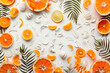 summer and beach inspired pattern, orange shades cutout at the bottom on white surface, natural elements,