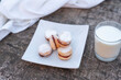 Freshly baked cookies on plate with glass of milk.