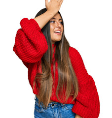 Canvas Print - Beautiful hispanic woman wearing casual clothes smiling confident touching hair with hand up gesture, posing attractive and fashionable