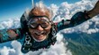 Skydiving senior expressing freedom in colorful gear against cloudy backdrop. Vibrant elderly man enjoying skydiving, blue skies and fluffy clouds surround.