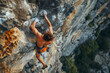 courageous rock climber hanging on a cliff
