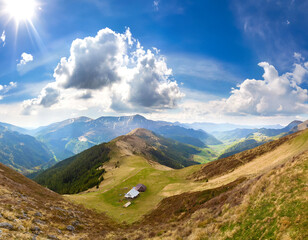 Wall Mural - Sunny afternoon. Beautiful spring scenery in the mountains. grassy terrain and rolling hills. 