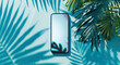 Smartphone mockup with blank screen on tropical blue background with palm leaf shadow