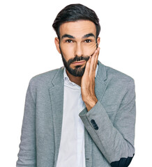 Wall Mural - Young hispanic man wearing business clothes thinking looking tired and bored with depression problems with crossed arms.