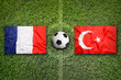 France vs. Turkey flags on soccer field