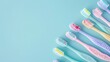 Colorful toothbrushes of dental tools on pastel blue background. AI generated image
