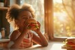 Cheerful smiling african american little girl with big hearty burger, enjoying in sunny kitchen