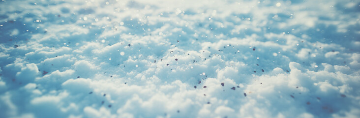 A snowy landscape with a blue sky