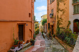 Fototapeta Uliczki - The narrow alleys and residential streets in the hilltop medieval Old Town at Menton, France, along the Cote d'Azur French Riviera.