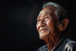 Elderly Asian man with a wise and happy expression, portrait of longevity and fulfillment.
