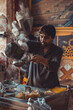 Pakistani street vendor pouring chai tea into cups in his roadside tea stall