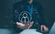 © Supatman - HR, Human Resources Targeting Concept in Business. Businessman use a virtual interface to target a human resource symbol, symbolizing recruitment and team management. Employment headhunting, HRM CRM,