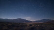 Night starry sky over the desert landscape