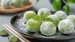 Close-Up photo of mochi dessert with matcha. Traditional Japanese sweet rice cakes with sweet fillings.