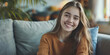 © dinastya - Smiling Teenage Girl sits on the couch at a psychologist's appointment. Smiling young girl enjoying a conversation.
