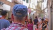 © rohawk - Middle Aged Disoriented Caucasian Male Tourist Watching Anonymous Crowd in Narrow Venice Street during Summer Vacation Season