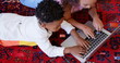 Image of social media notifications over biracial brother and sister using laptop