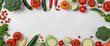Vegetables arranged on white wooden backdrop