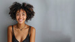 Afro woman wearing black ribbed V-Neck Body smiling, isolated on grey