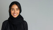 © pariketan - Arab woman wearing black ribbed V-Neck Body smiling isolated on grey