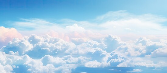 Wall Mural - The electric blue sky was filled with fluffy cumulus clouds as the airplane soared through the atmosphere, offering a breathtaking view of the natural landscape below