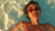  high angle of female in sunglasses and swimwear sunbathing and floating on water in swimming pool on summer vacation