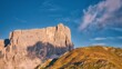 Rocky mountain and grassy hill in Dolomites, Italy