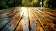 Close up of wooden table with water droplets on it and trees in the background.