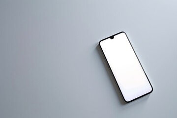 Aufkleber - A contemporary smartphone with a blank screen lying diagonally on a plain gray background suitable for digital mockups