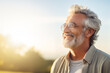 © Darya - Senior man with glasses enjoying sunset, serene and happy elderly lifestyle, gentle retirement concept.