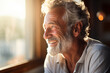 Happy elderly man in sunlight, radiant with joy, capturing a moment of pure contentment and warmth.