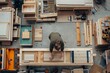 The top-down image showcases a woodworking area cluttered with tools, creating a sense of busy craftsmanship and manual labor
