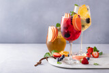 Fototapeta Mapy - Refreshing summer sangria with berries and fruits with red and white wine
