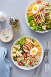 Fototapeta Mapy - Healthy lunch bowl with grilled chicken, roasted vegetables, fresh lettuce, cooked lentils, salad and boiled egg