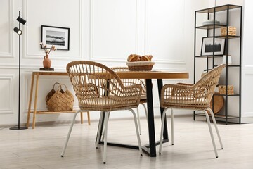 Aufkleber - Dining room interior with wooden table and wicker chairs