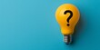 Light bulb with question mark symbol on blue background, concept of ideas and creativity