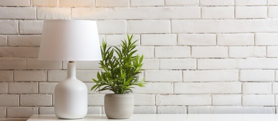 Wall Mural - A simple and elegant setup featuring two white vases with green plants placed on a clean white table
