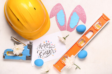 Sticker - Composition with greeting card, construction tools and Easter decor on light background