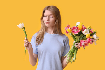 Sticker - Thoughtful young woman with beautiful tulips on yellow background