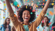 © red_orange_stock - Happy young woman with arms raised celebrating moment joyfully with colorful confetti around.