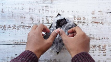 Poster - top view of man hand pick date fruit from a box