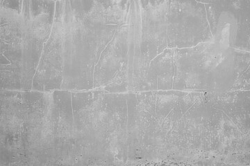 Wall Mural - Front view of a cracked, weathered and dirty stone or concrete wall in black and white. Abstract high resolution full frame textured background, copy space.