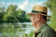 fisherman in a boater hat by the riverside
