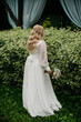 The bride in a white wedding dress from the back