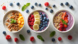 Assorted acai and smoothie bowls with fresh fruit toppings and nuts on a light surface. Health-conscious breakfast and superfood concept. Menu concept design for poster, banner,  advertisement
