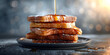 A loaf of bread with honey dripping down the side, French toast with black background , 
