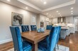 Dining room with wooden table and blue chairs.